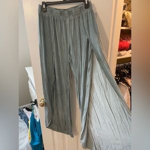 Turquoise flowy pants with slit all the way down the front on both legs